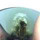 A rear close-up of a very cute girl's ass as a short hang drops, then she pulls a tampon. Brief clip. Filmed from a between the legs perspective. Vertical format video. About a minute.